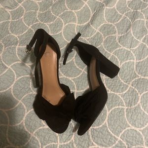 Size 8.5 classic black heels with bow detail and ankle strap